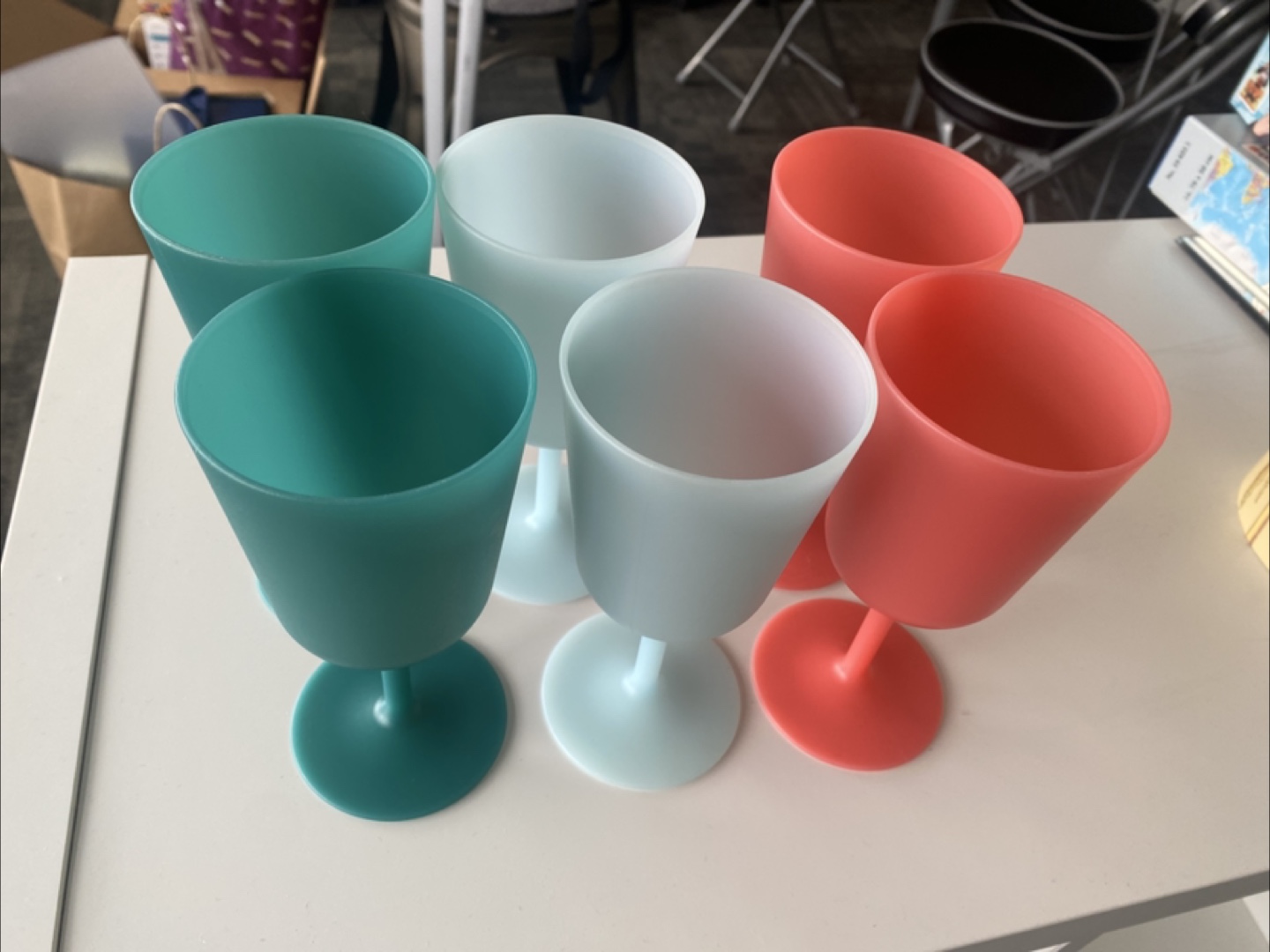Set of six pastel coloured plastic wine glasses
