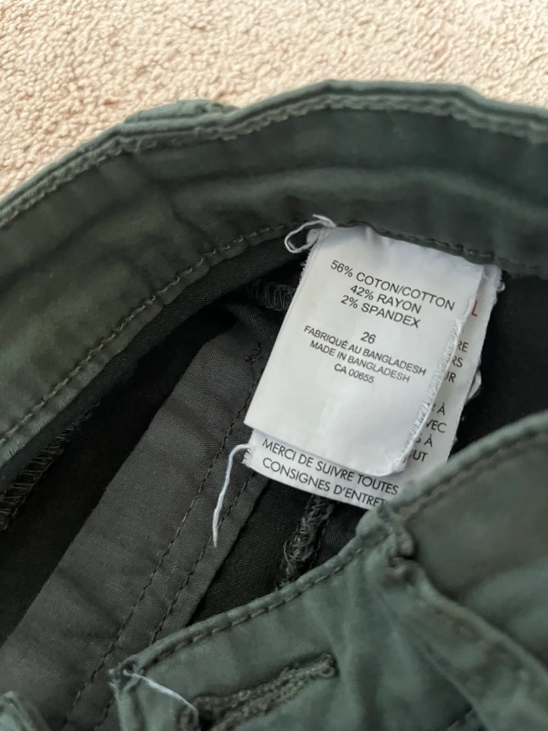 Two pairs of women's pants, mint green and dark green image indicator(3)