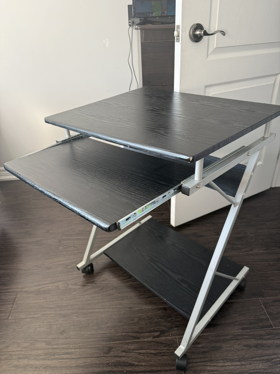 Small black computer desk with keyboard tray and wheels - photo 3