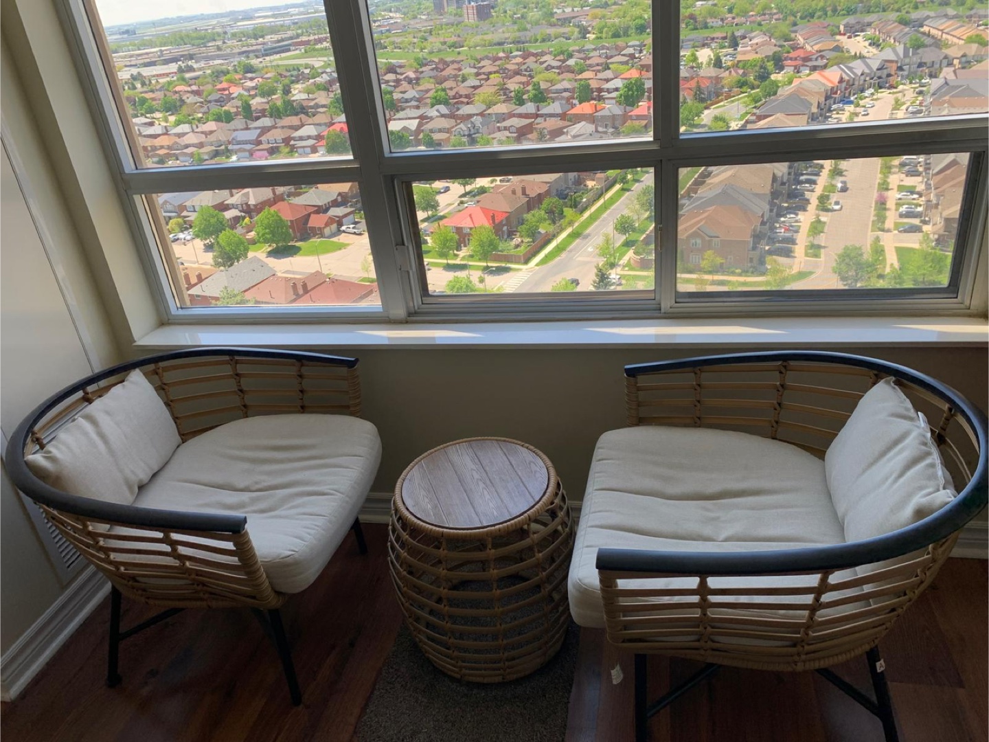 Pair of Rattan Armchairs with Cushions and Small Table