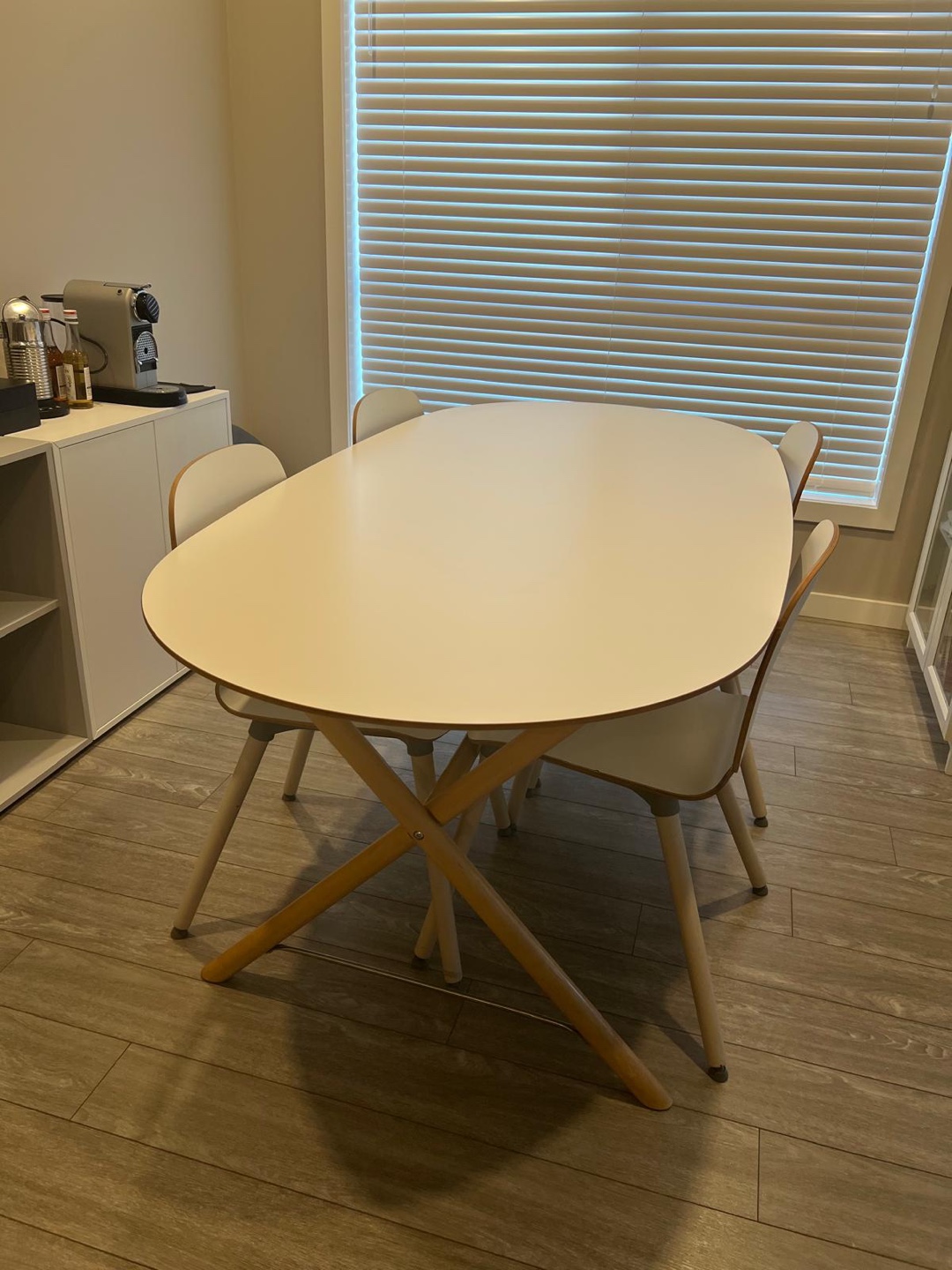 White Oval Dining Table with Four Chairs
