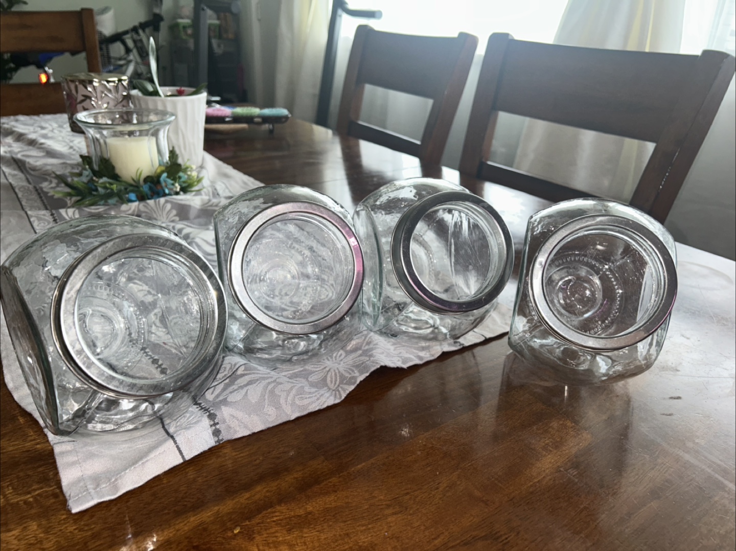 Set of Four Glass Canisters with Silver Lids