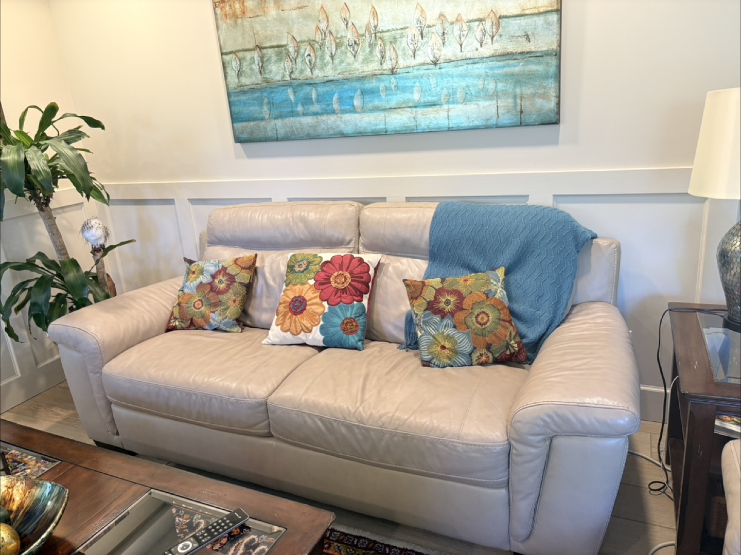 Beige Leather Sofa with throw blanket