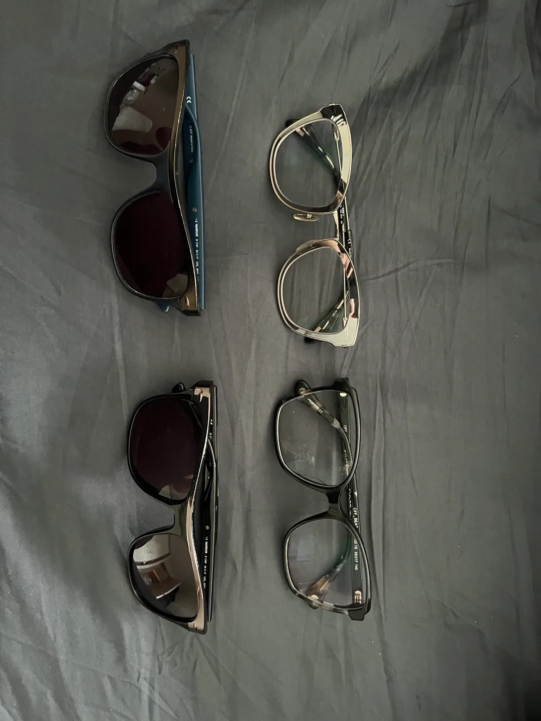 Four pairs of sunglasses and eyeglasses thumbnail