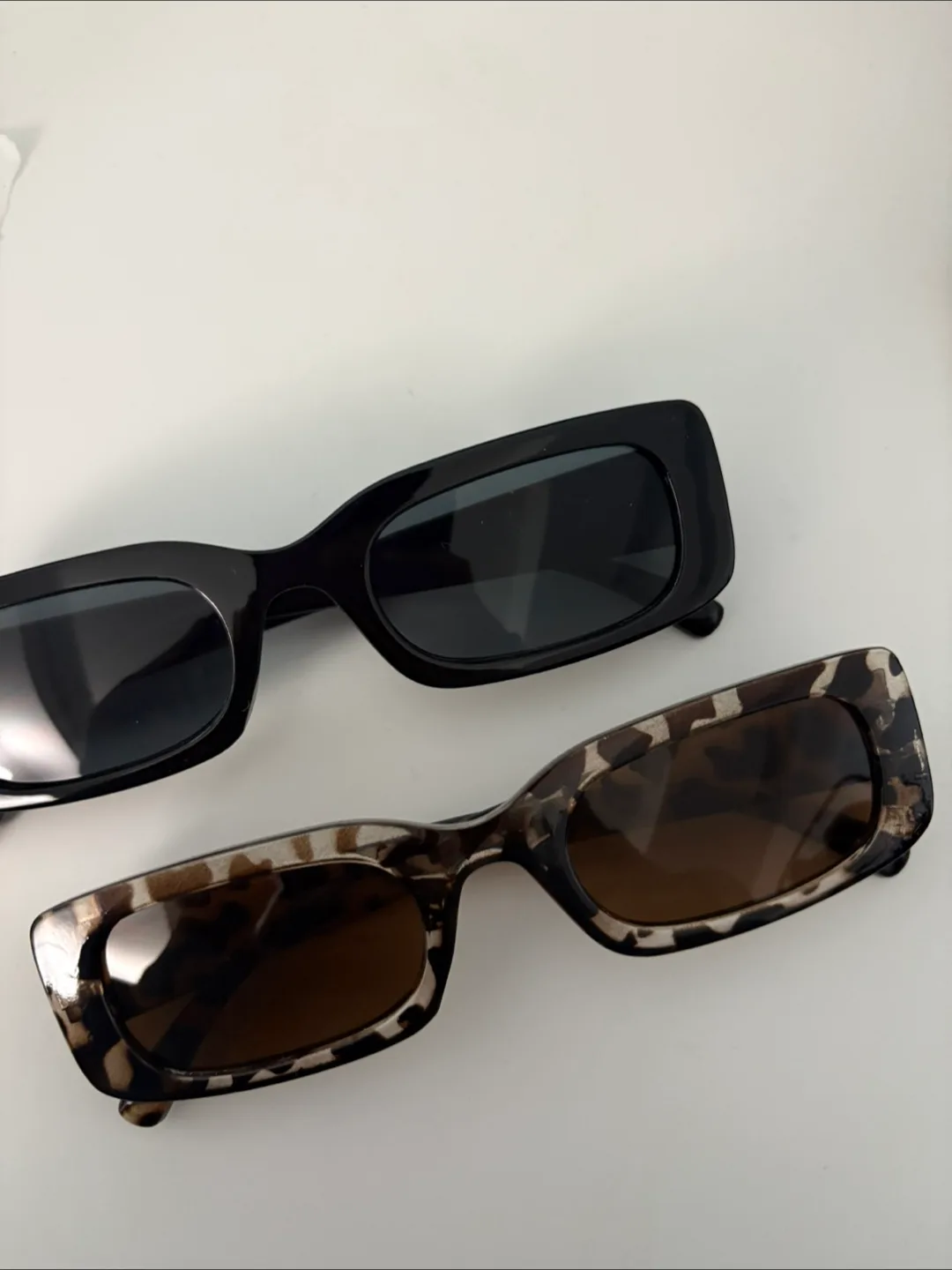 Two pairs of sunglasses thumbnail