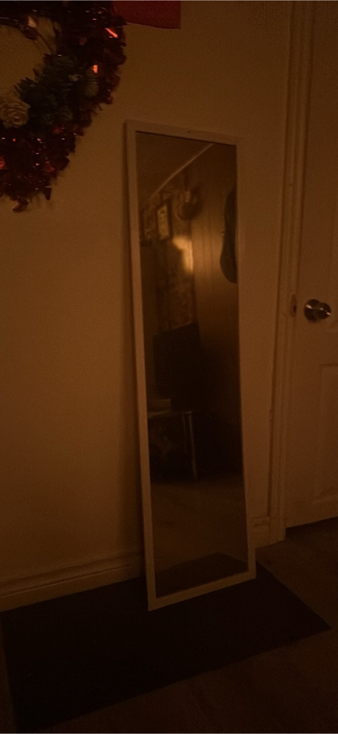 Full-length mirror with white frame
