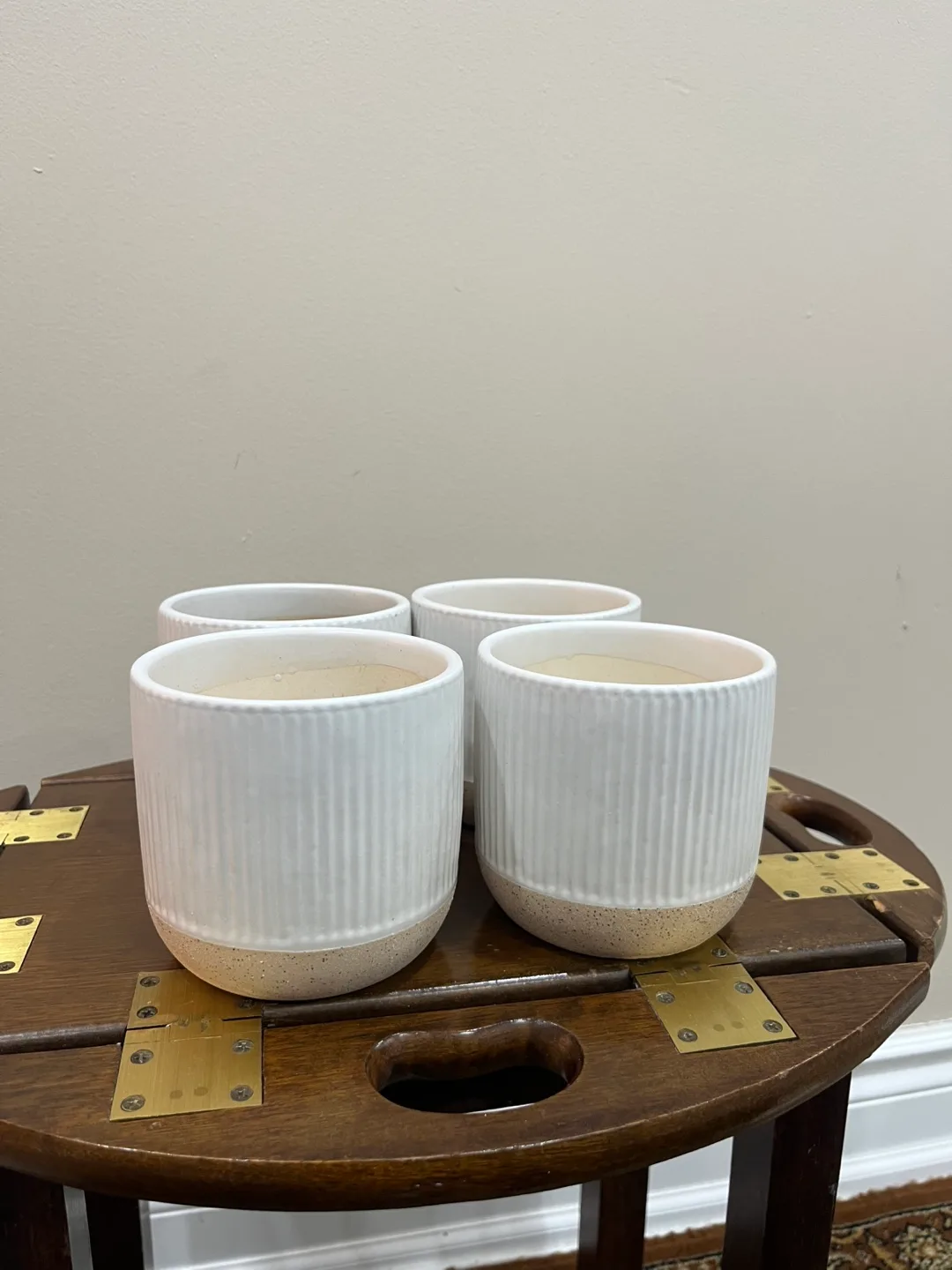 Set of four white ribbed ceramic planters image indicator(3)