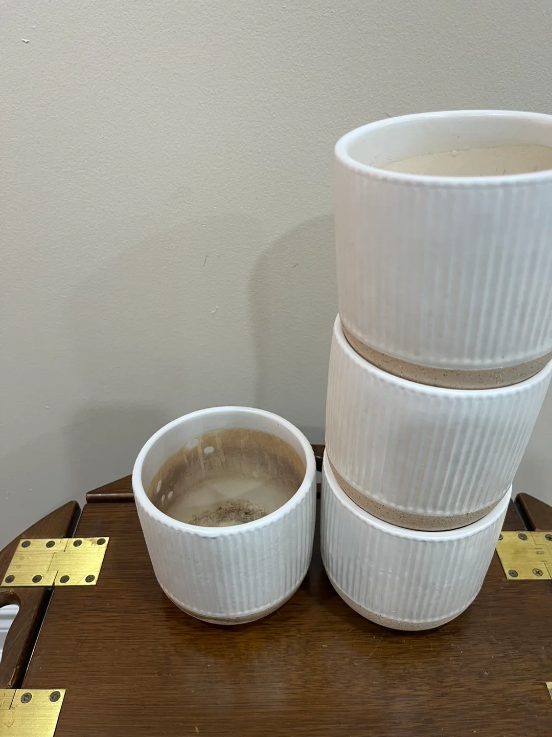 Set of four white ribbed ceramic planters image indicator(4)