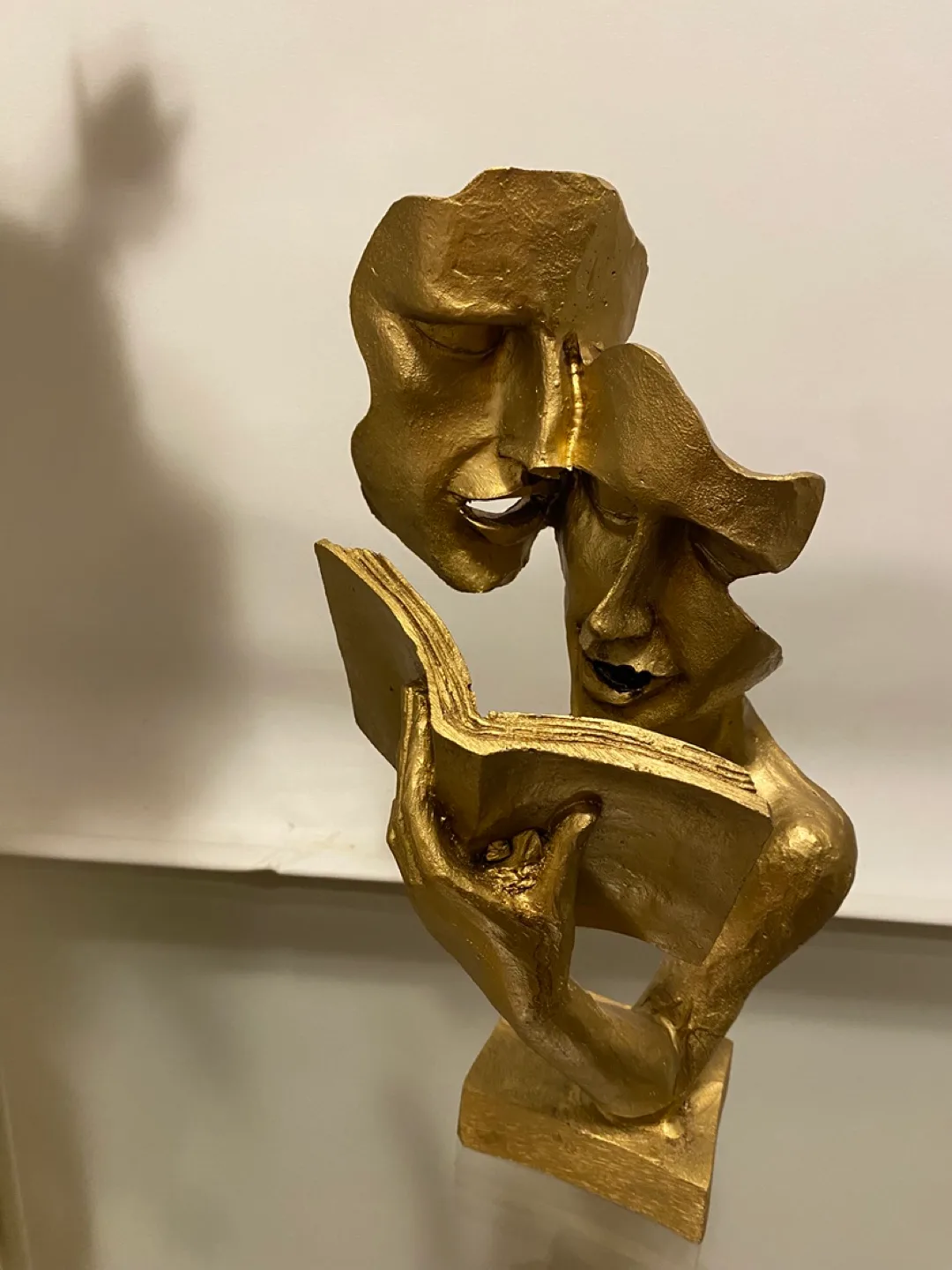 Gold Figurine of Two Faces Reading a Book image indicator(2)