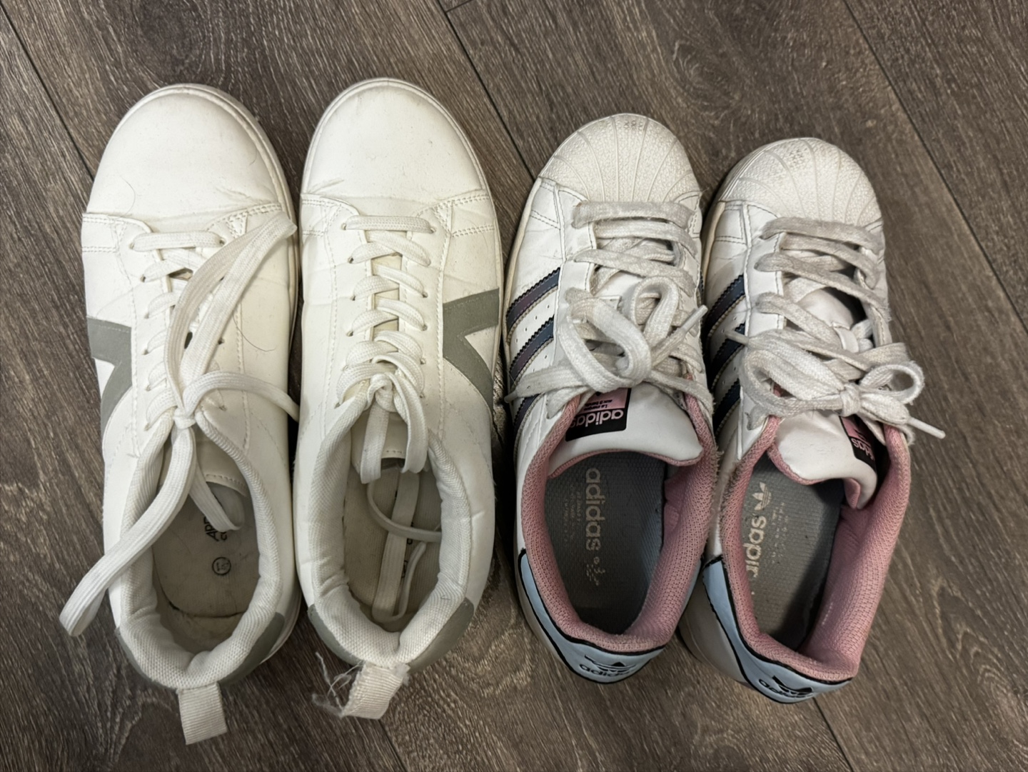 Two pairs of women's white sneakers