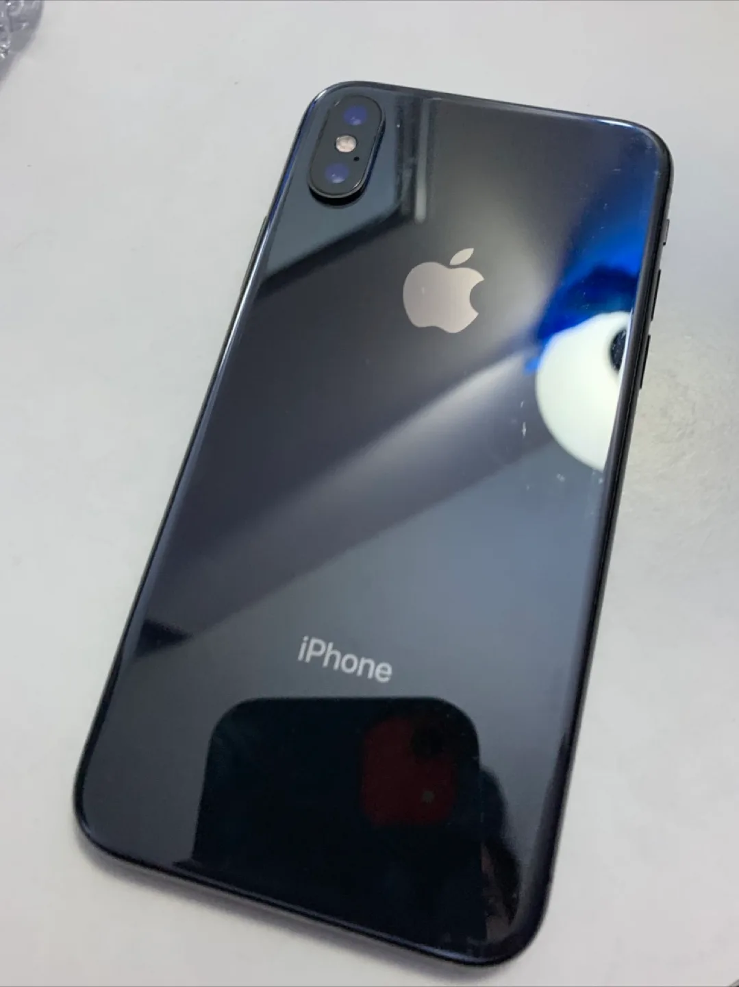 iPhone X in Black with Case 64GB