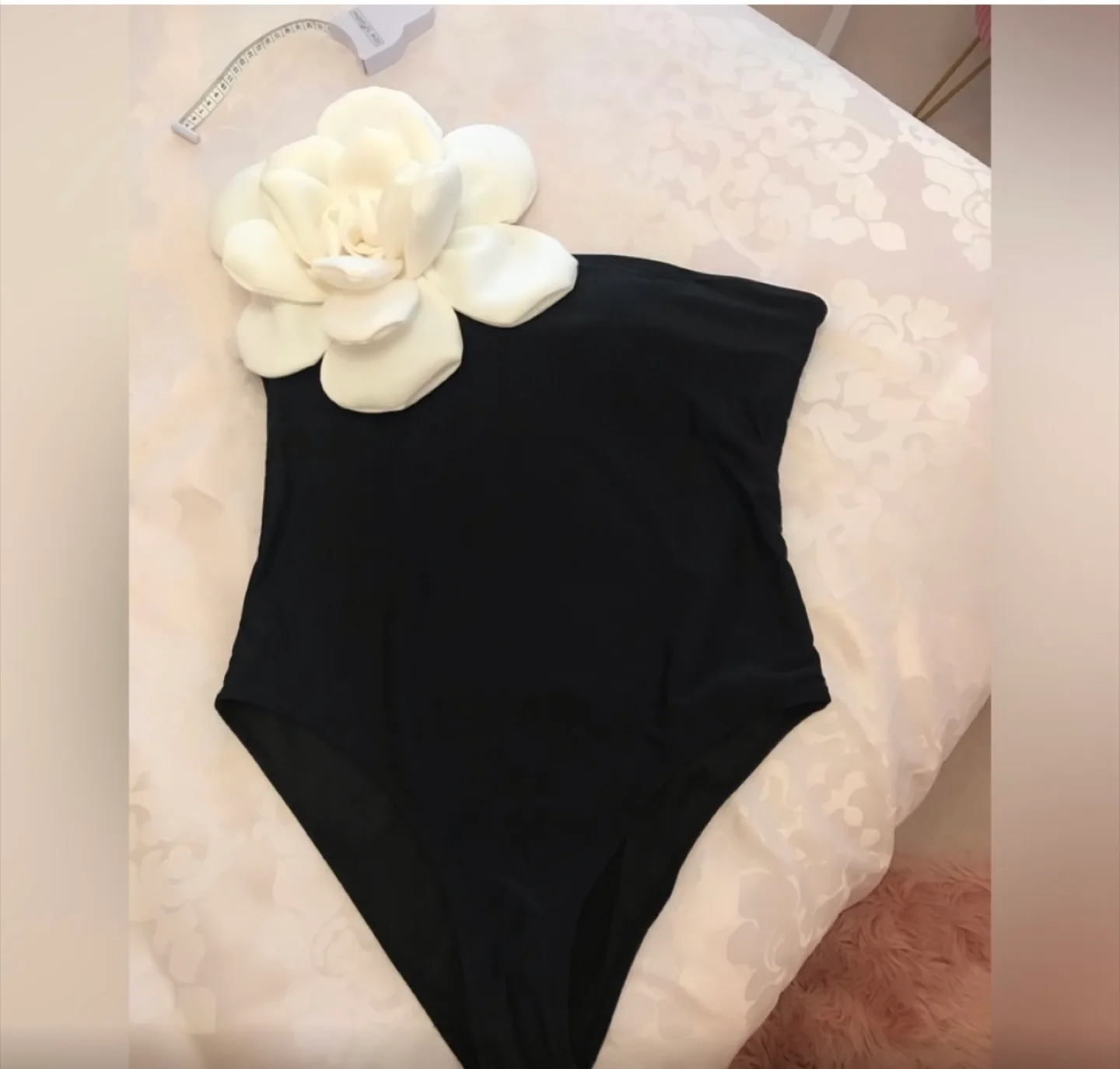 Macy’s One Shoulder Black Swimsuit with White Flower Detail thumbnail