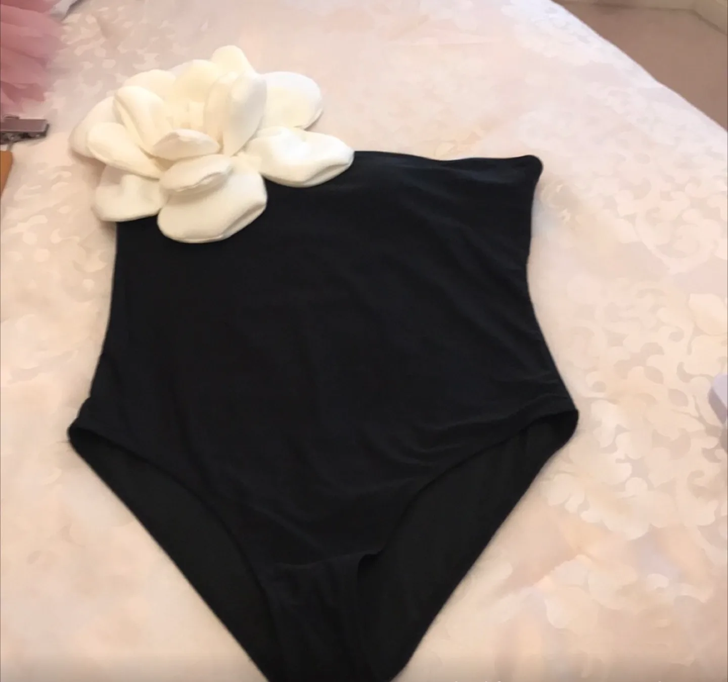 Macy’s One Shoulder Black Swimsuit with White Flower Detail image indicator(2)