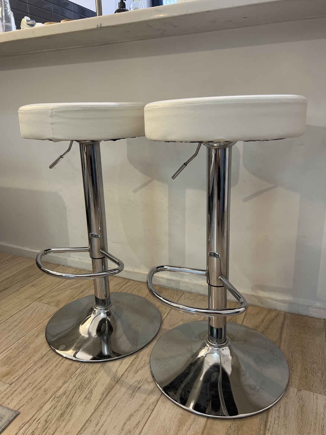 Pair of White Faux Leather Bar Stools with Chrome Base