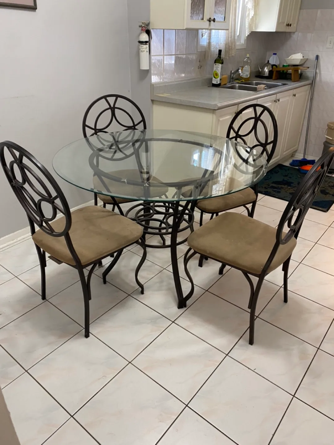 Glass-top dining table set with four chairs thumbnail