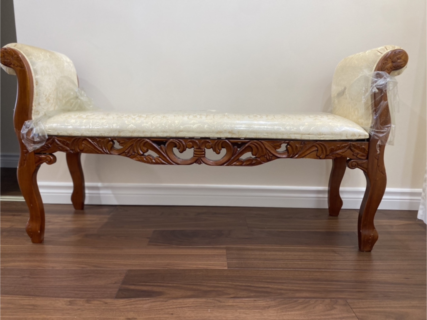 Ornate Wooden Bench with Upholstered Seat