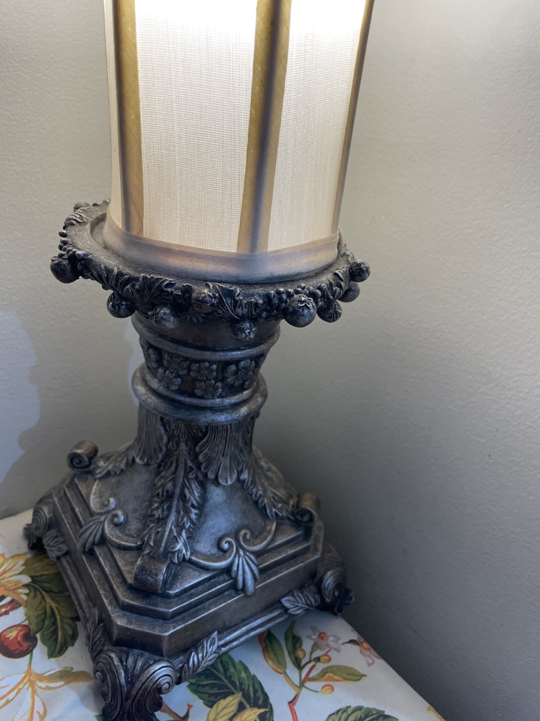 Elegant Table Lamp with Ornate Base and Cream Shade