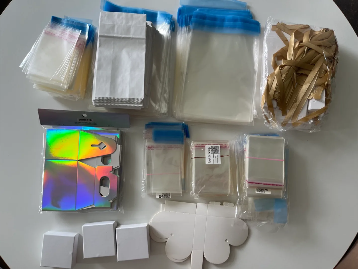Bulk lot of packaging supplies: boxes, bags, and ribbon thumbnail