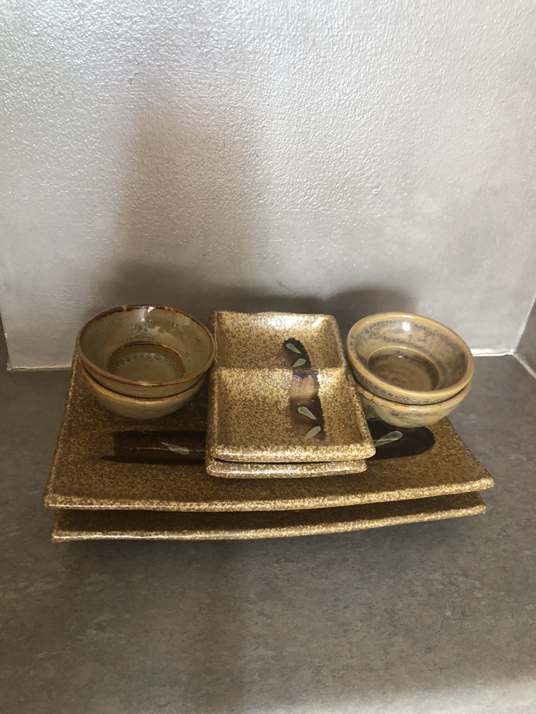Set of Japanese-style ceramic appetizer plates and bowls