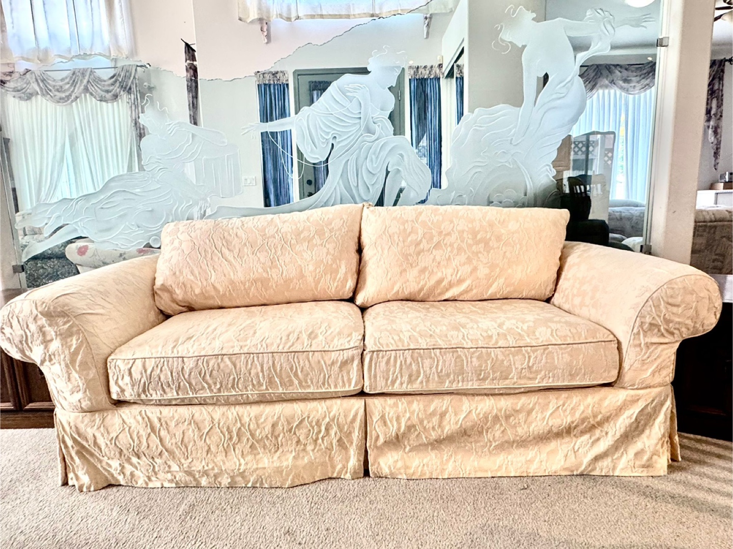 Cream-coloured loveseat with floral pattern