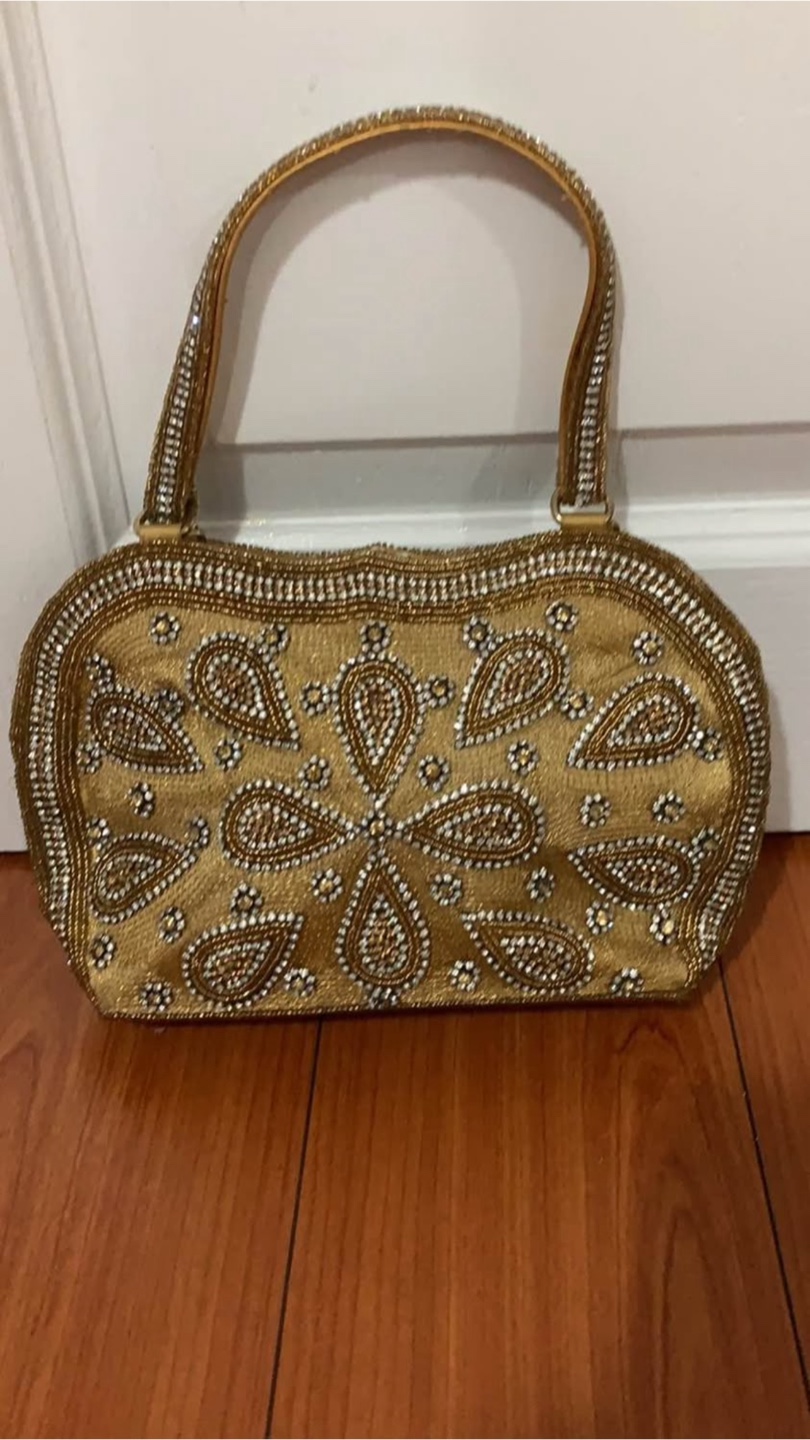 Three Stylish Handbags - Black, Gold, and Patterned