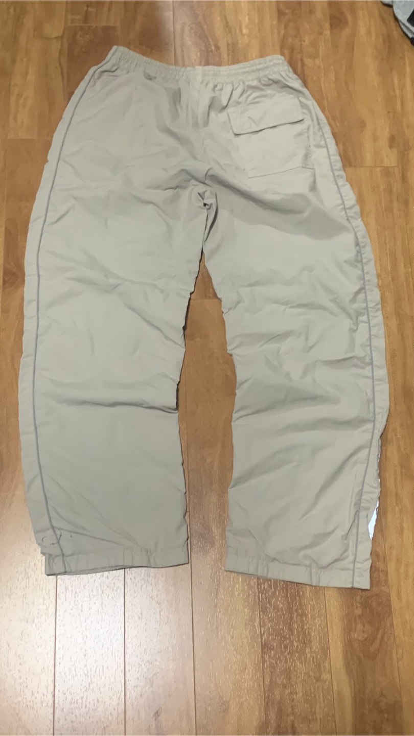 Beige Nike track pants