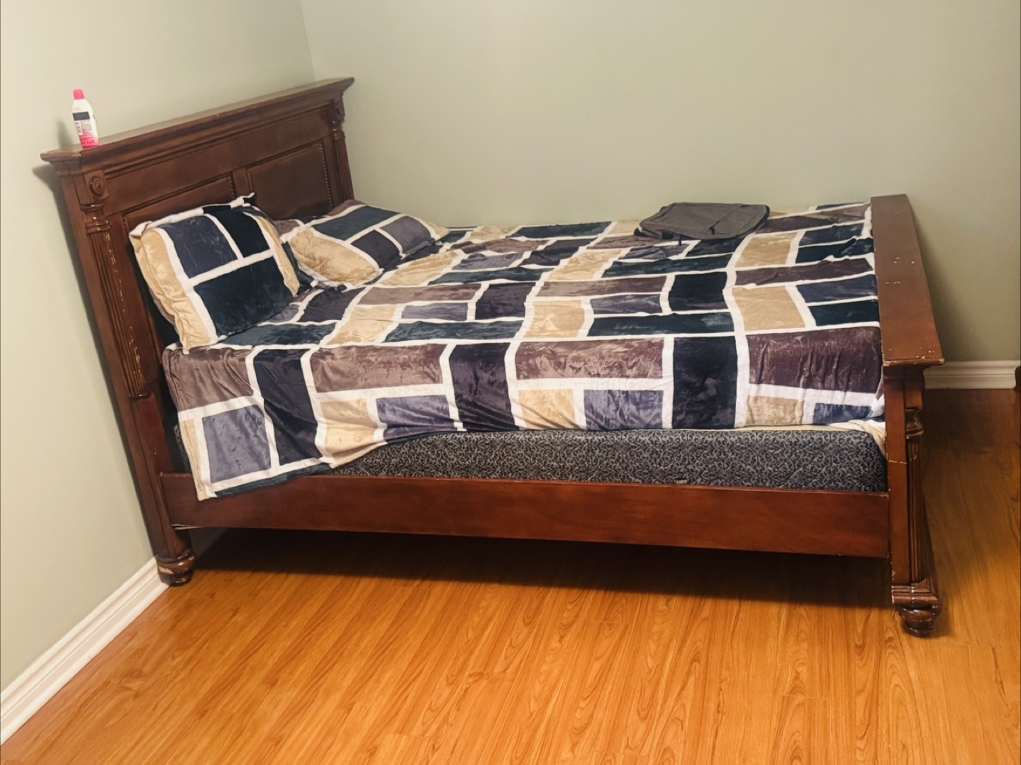 Wooden bed frame with mattress