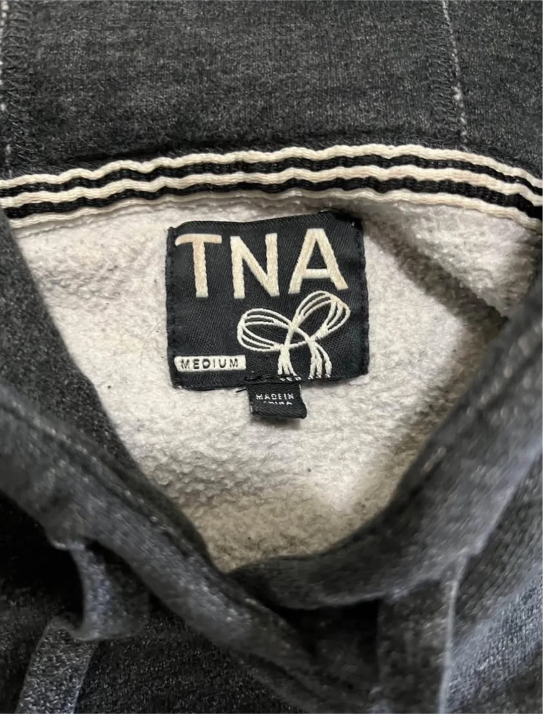 TNA women’s medium hoodie, grey with teal logo image indicator(2)