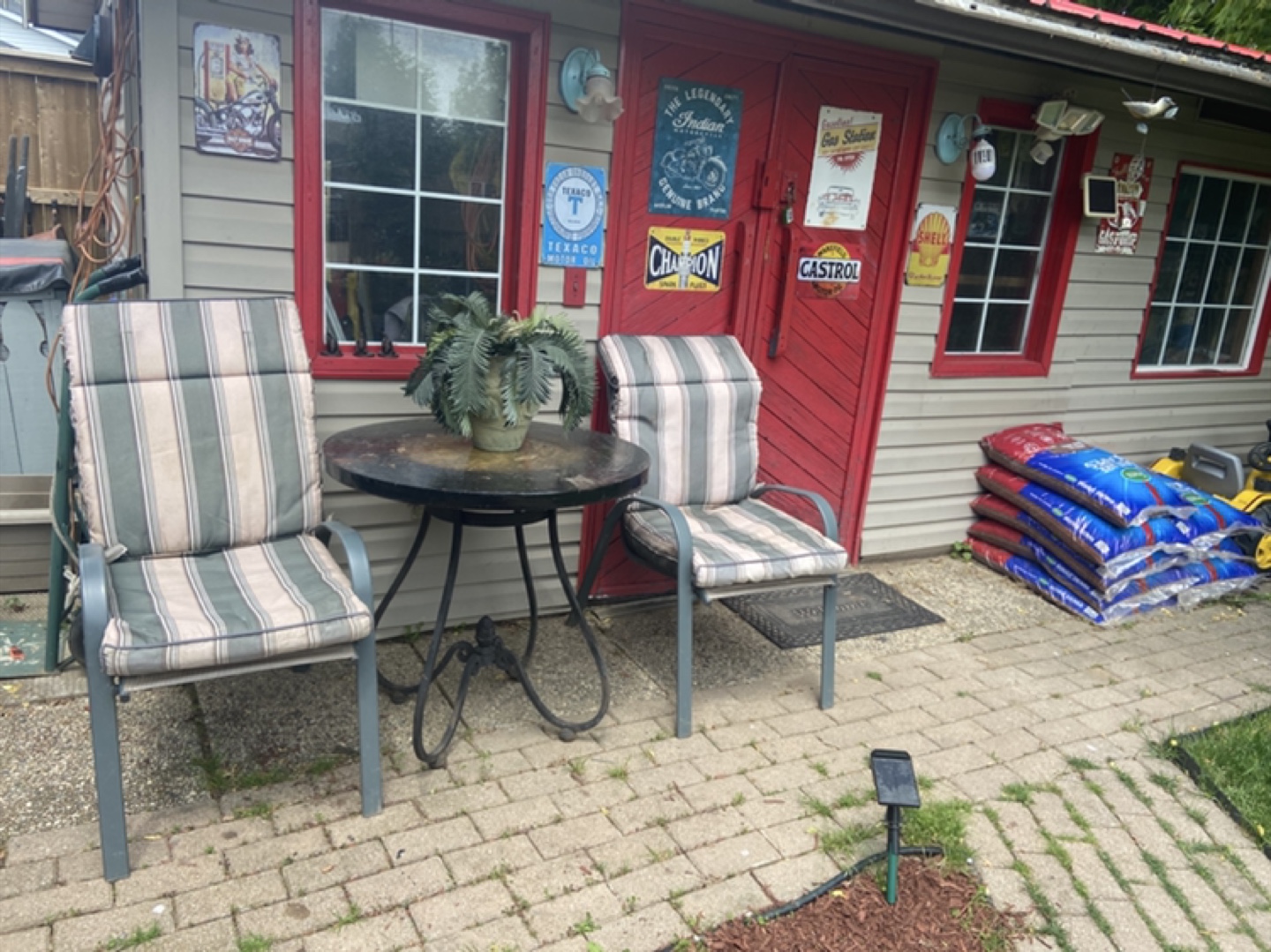 Iron table with lounge chairs and pads