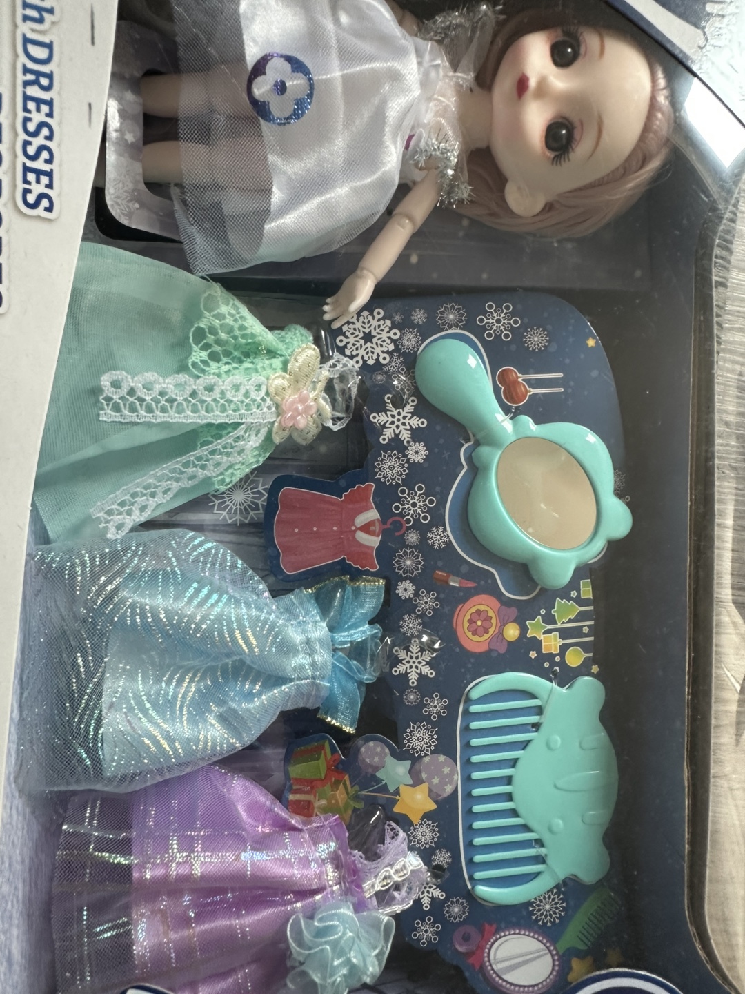 Doll with Dresses and Accessories