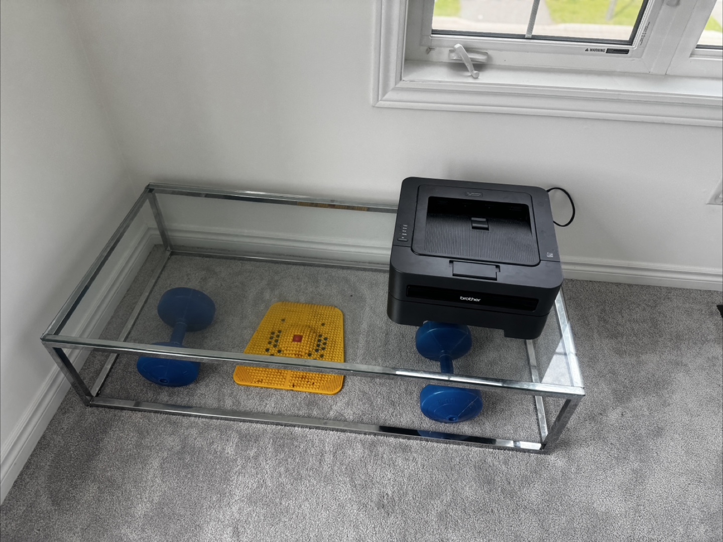 Glass top table with metal frame