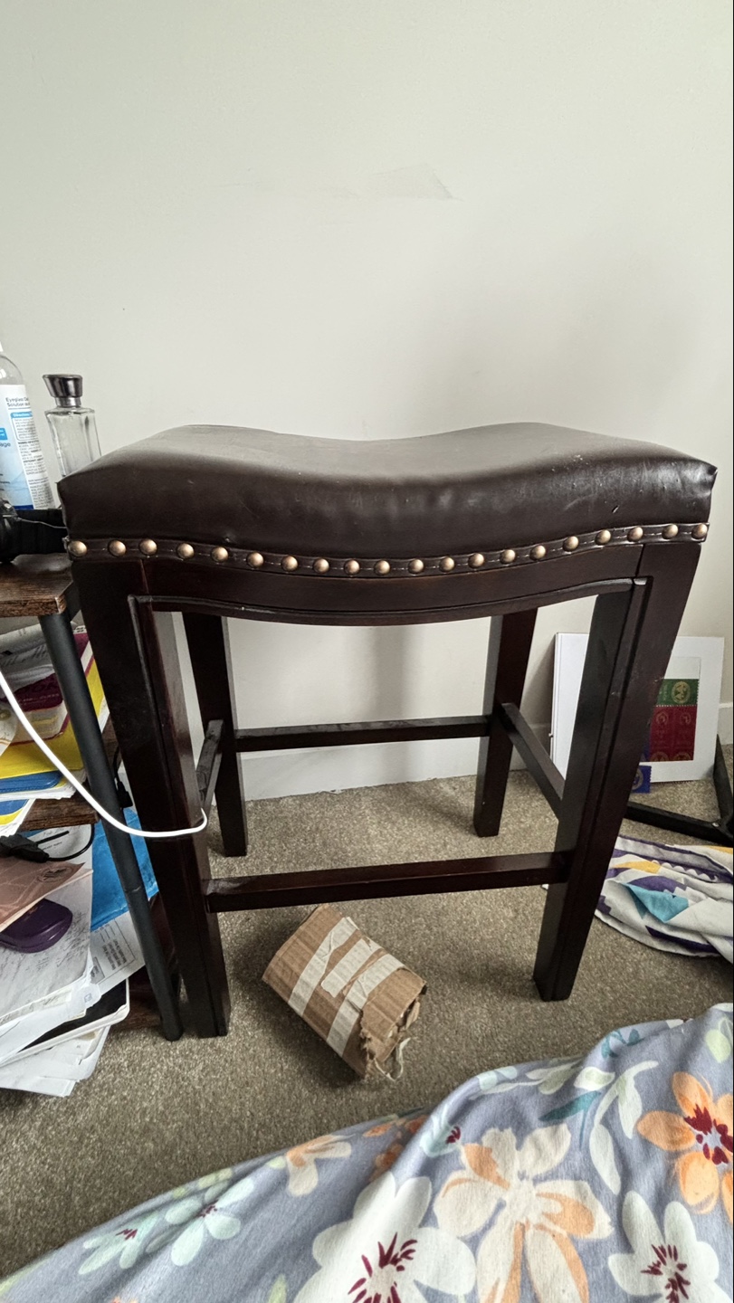 Dark brown leather saddle stool