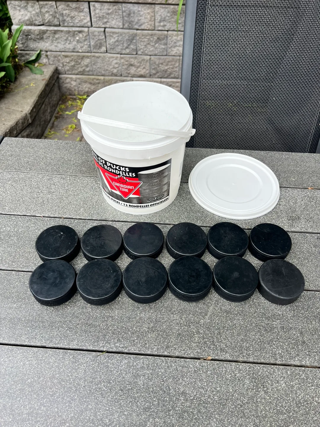 Pail of 12 Hockey Pucks image indicator(2)