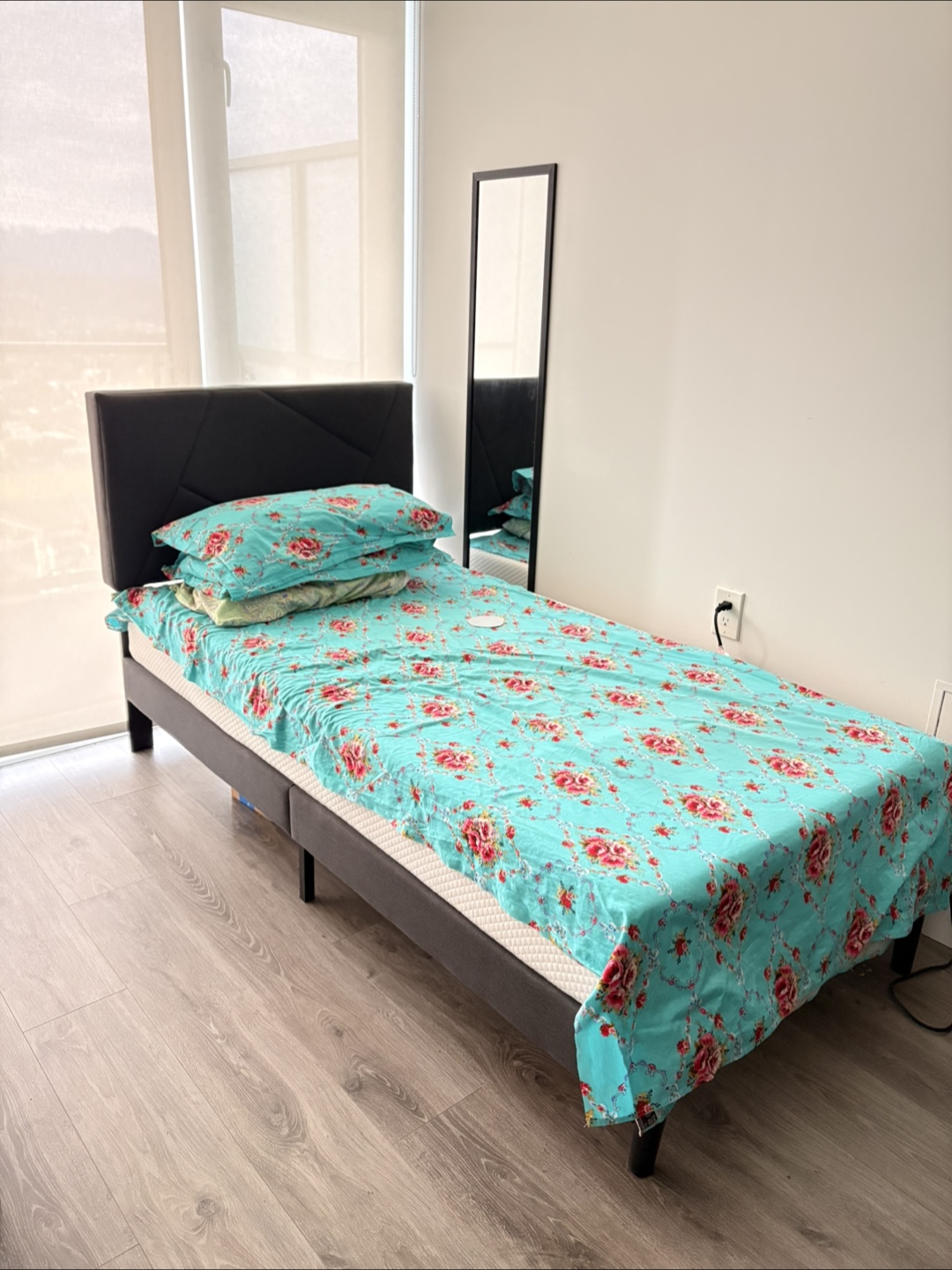 Twin bed frame with a headboard
