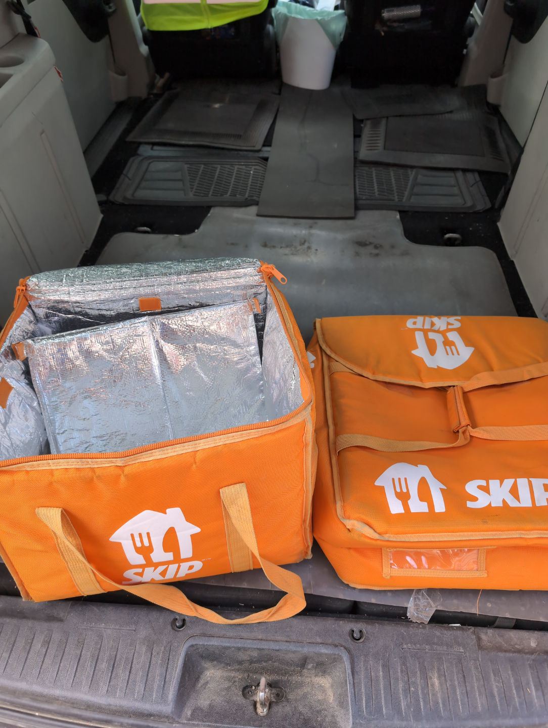Two SkipTheDishes insulated delivery bags