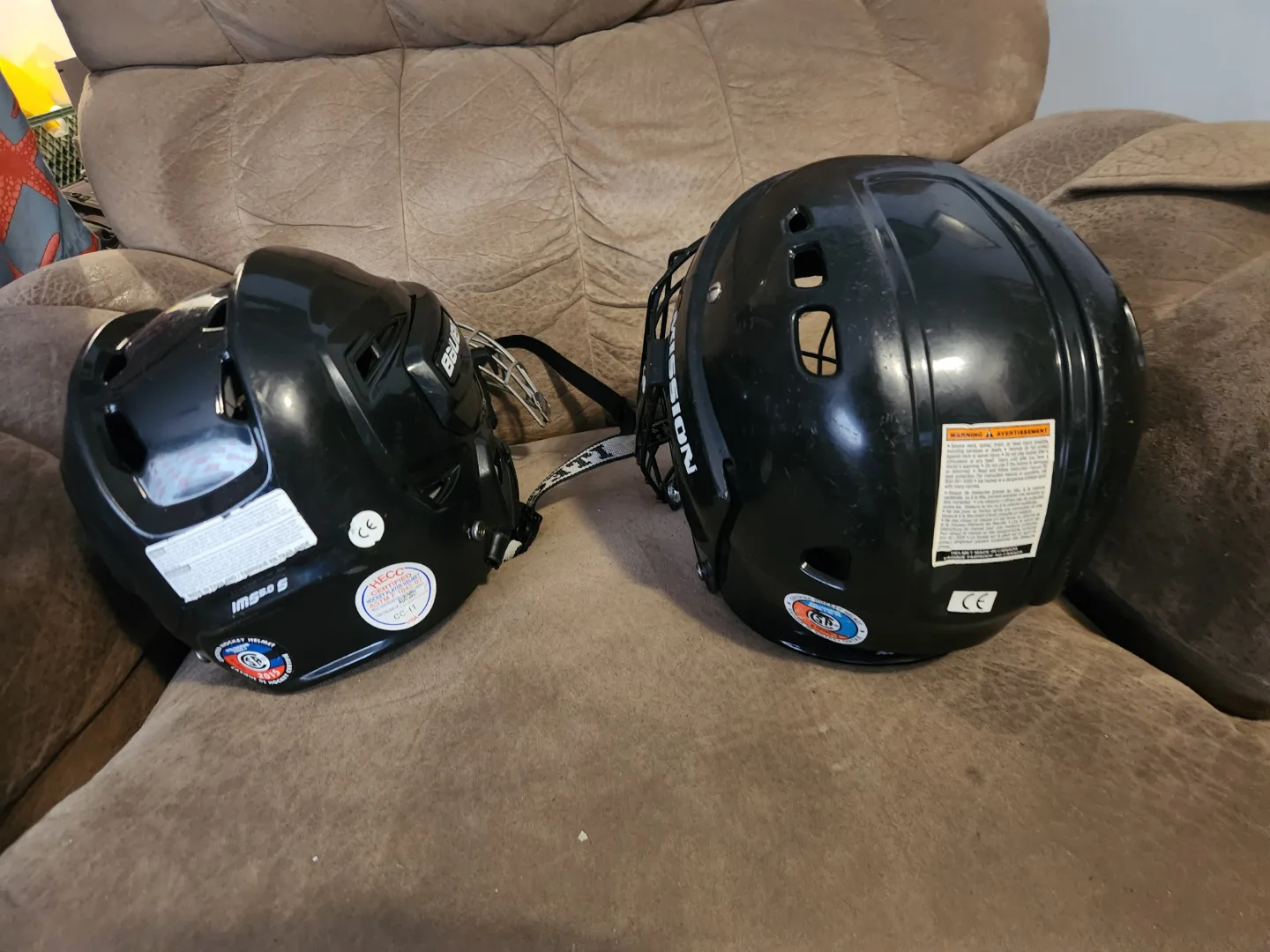 Two Used CCM Hockey Helmets with Cages image indicator(2)