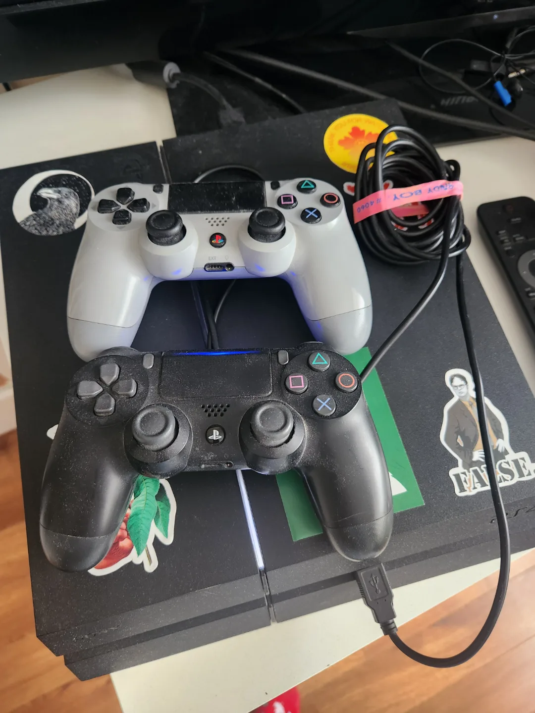 PlayStation 4 with two controllers thumbnail