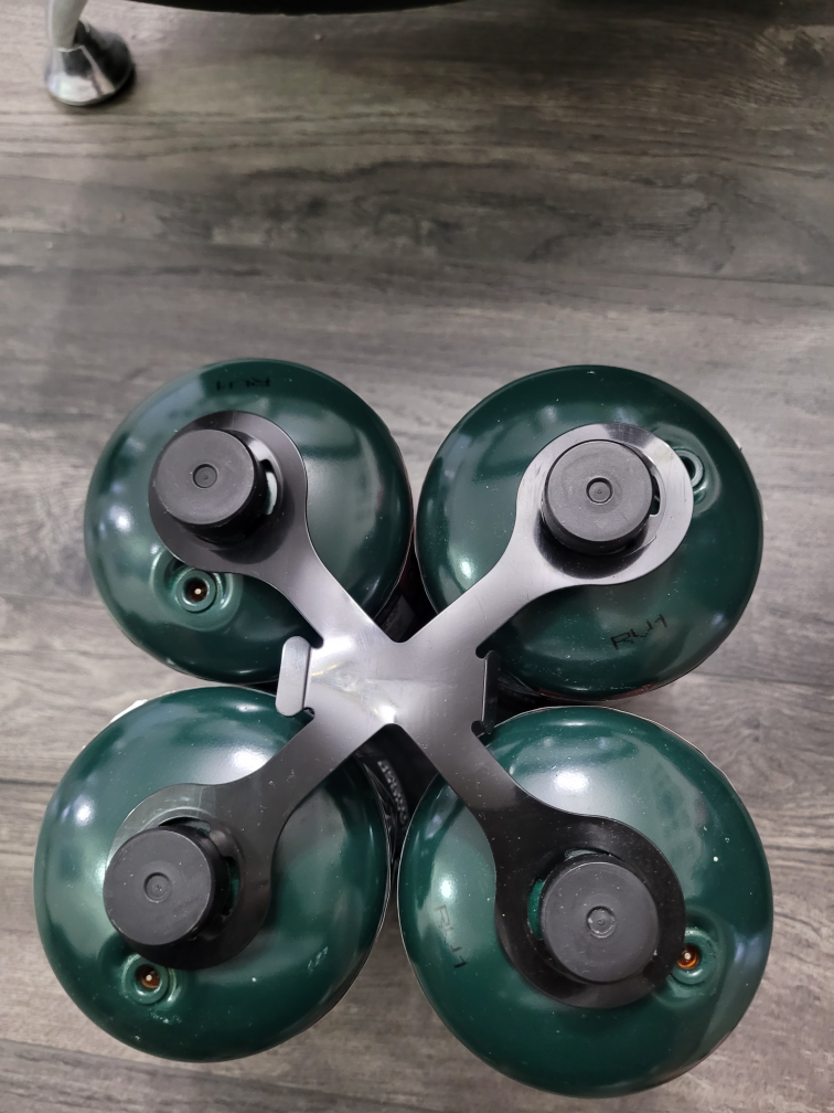Four Coleman 16 oz Propane Tanks with Carrier