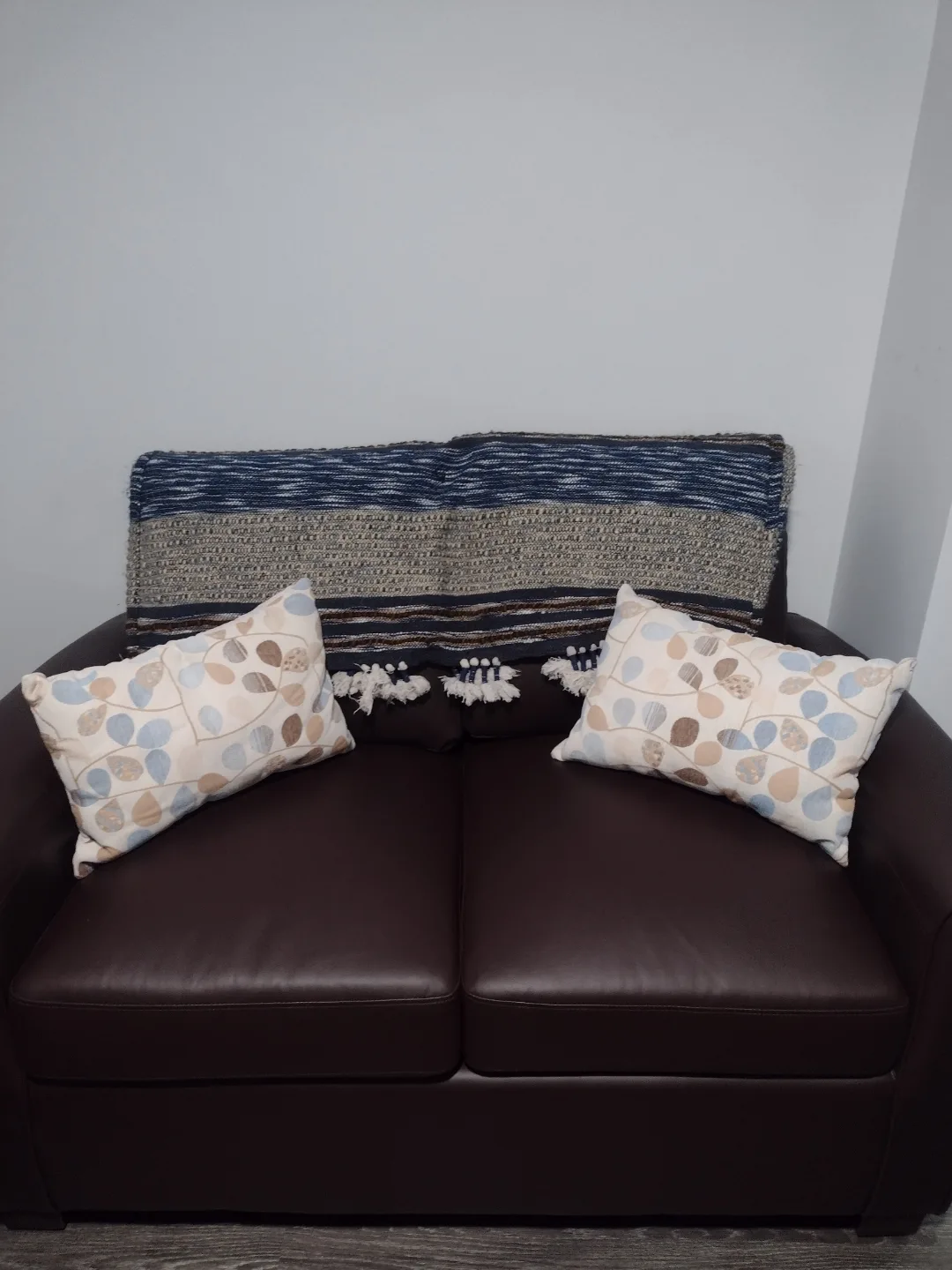 Brown Leather Loveseat with Throw and Pillows thumbnail