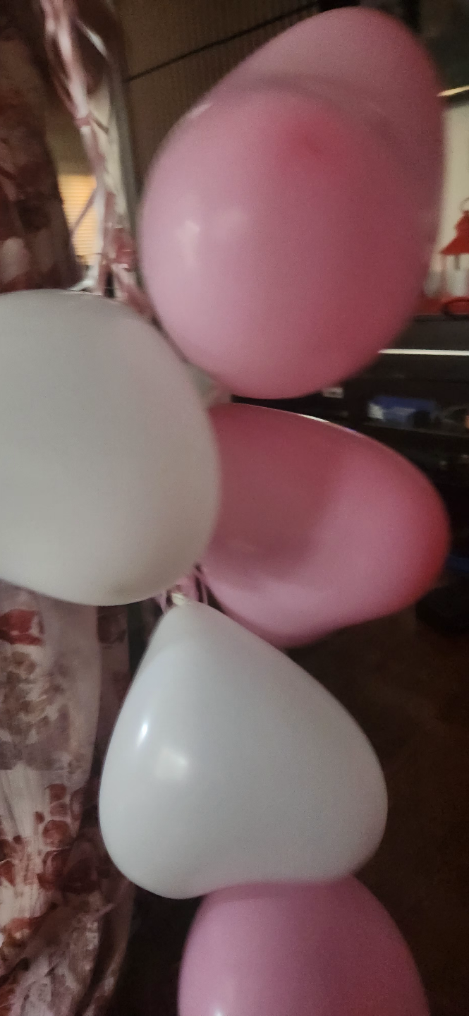 6 heart shaped pink and white helium balloons inflated