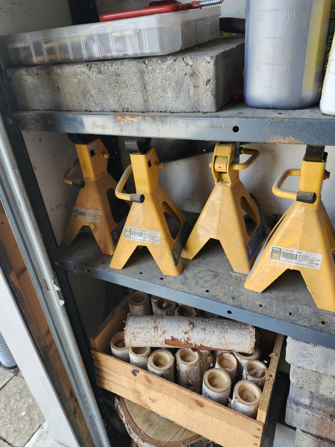 Four Yellow Powerbuilt 3-Ton Jack Stands