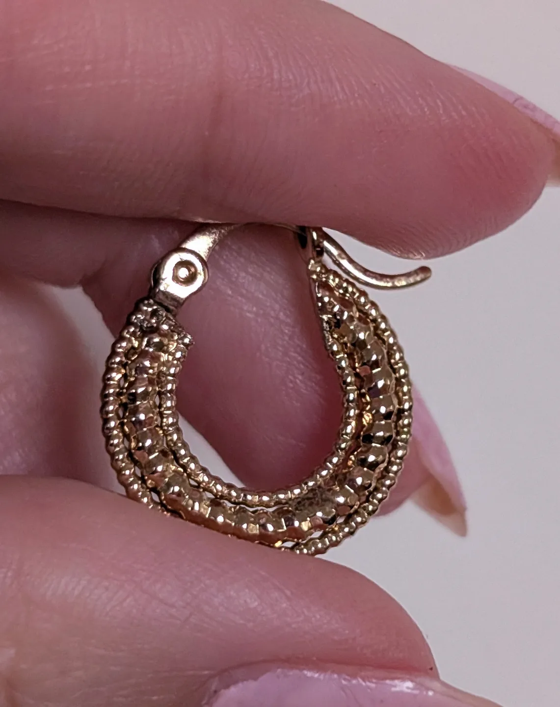 Small Gold Tone textured hoop earrings image indicator(5)