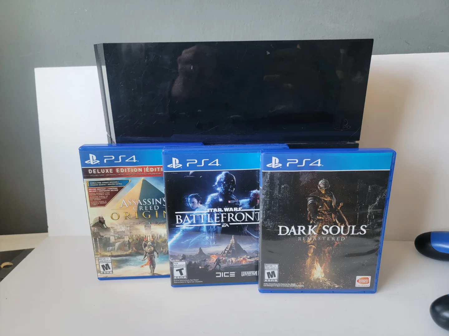 PS4 Console with 2 Controllers and 3 Games image indicator(2)