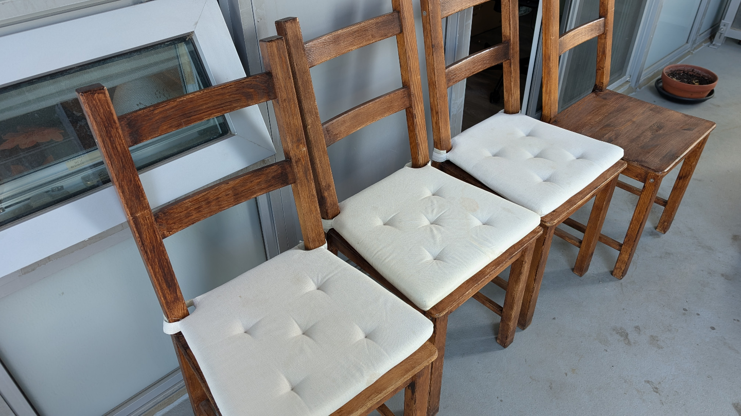 White Table and Four Wooden Chairs