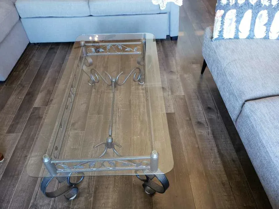 Elegant Glass-Top Coffee Table with Ornate Metal Frame