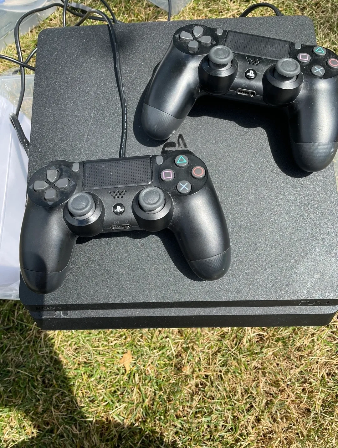 Sony PlayStation 4 Slim Console with Two Controllers and HDMI thumbnail