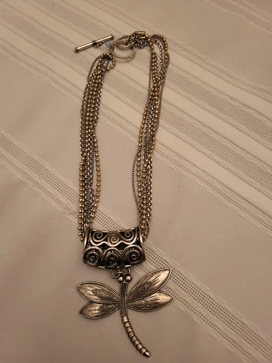 Multi-strand necklace with dragonfly pendant thumbnail