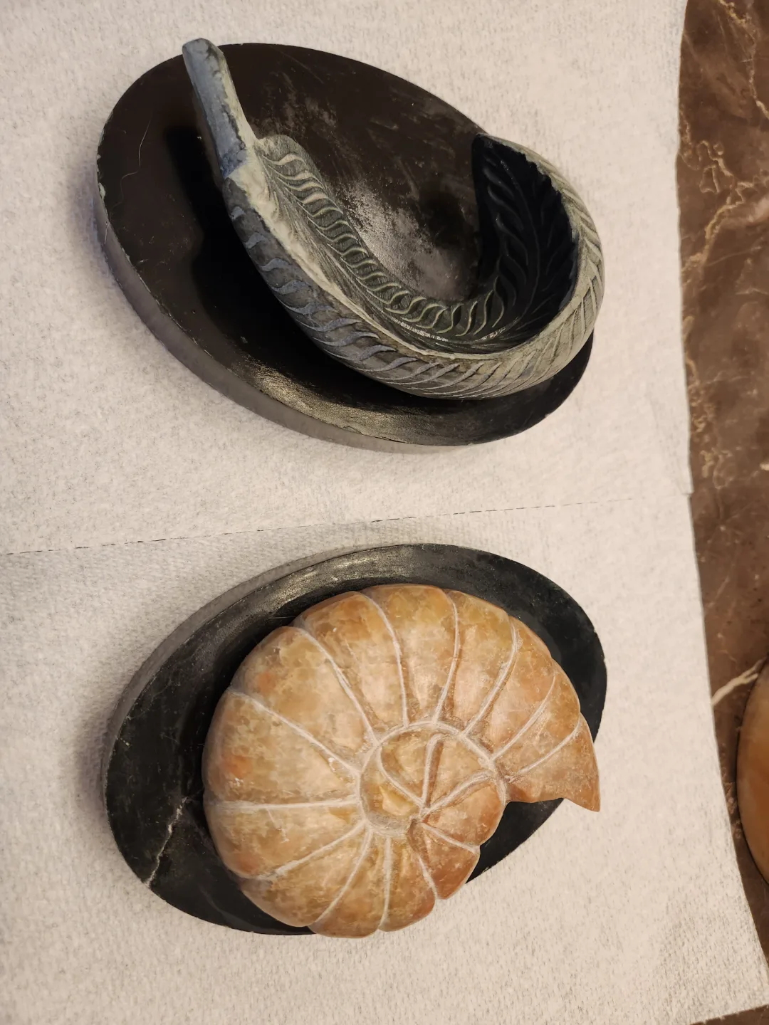 Two Carved Stone Sculptures on Marble Bases image indicator(2)