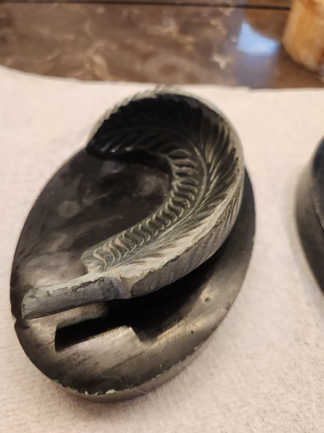 Two Carved Stone Sculptures on Marble Bases image indicator(3)