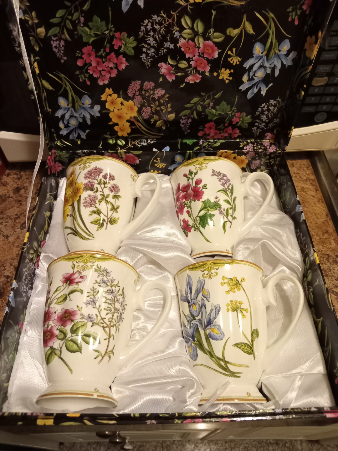 Set of four floral mugs